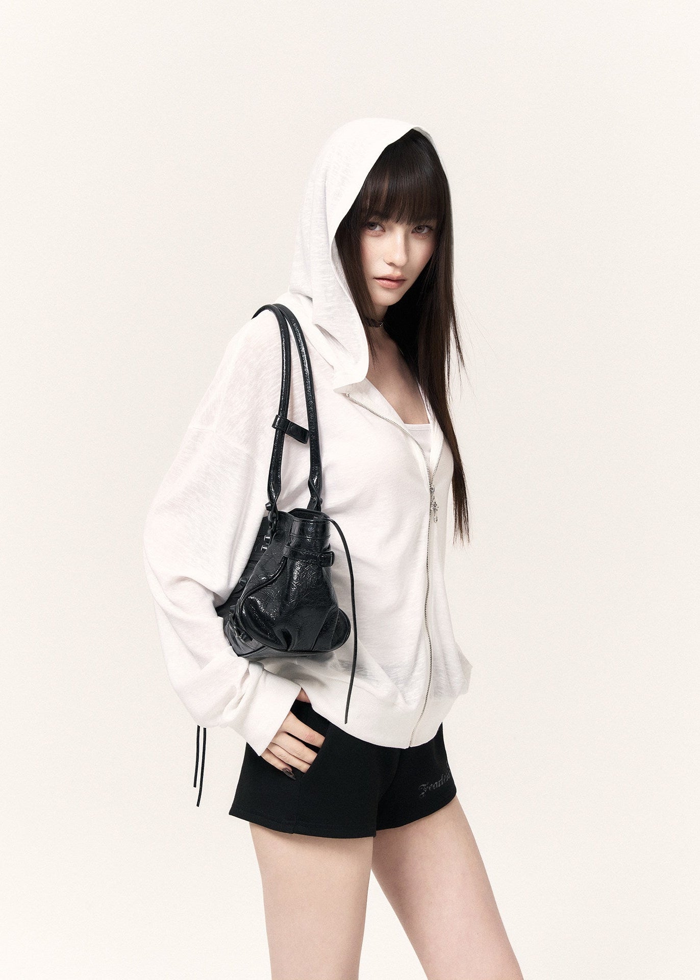 Black casual shorts with a drawstring waist, cross pendants, and lettering print
