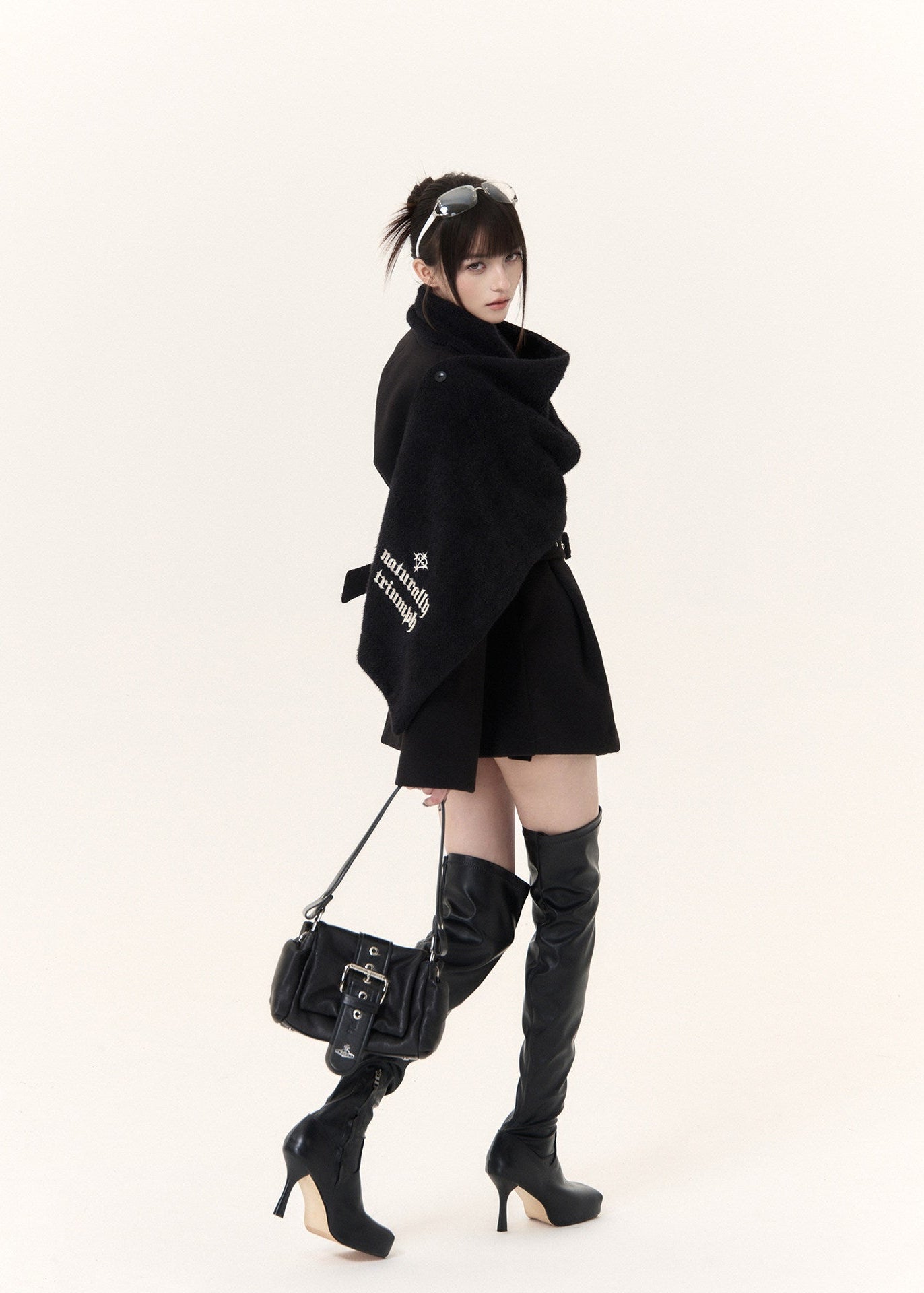 Black wool blend coat with embroidered scarf detail and fitted waist belt