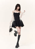 Feminine corset-style mini dress with halter straps and lace sleeves