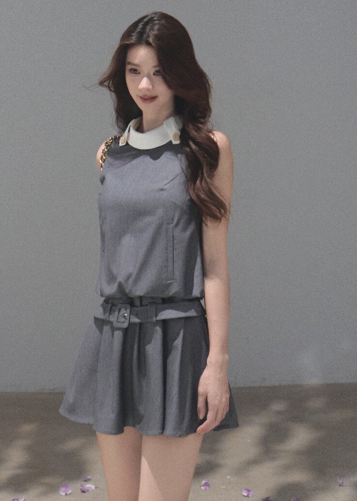 Sleeveless commuter-style dress with a white collar and gold-tone buttons