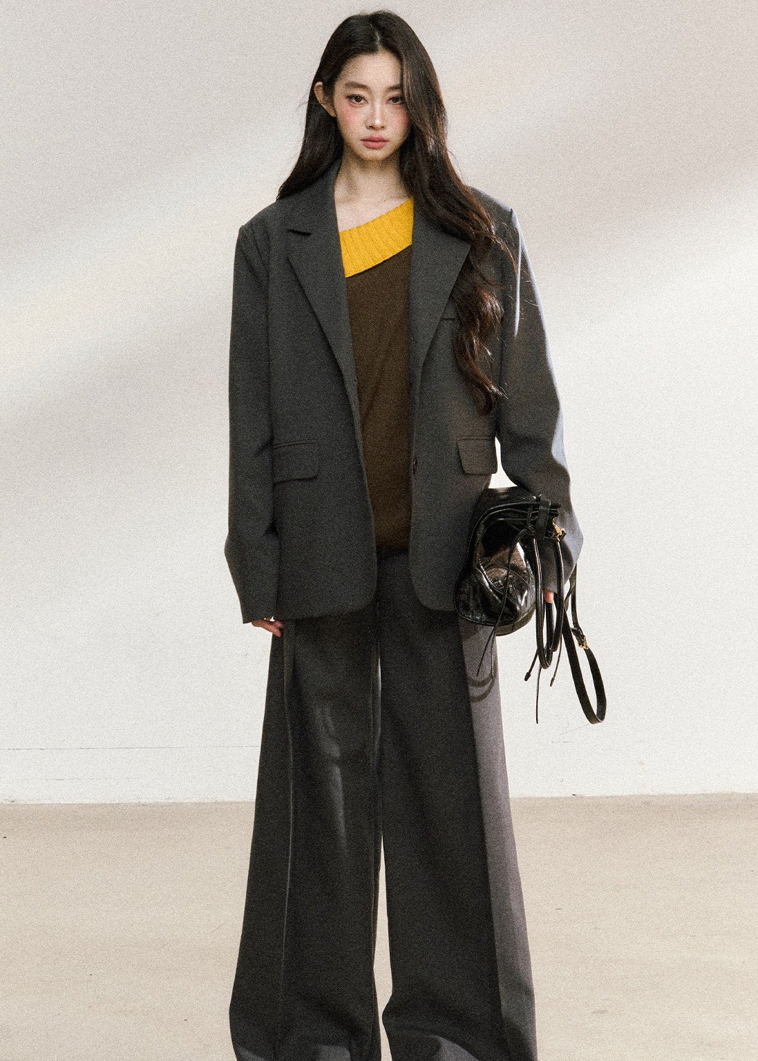 Women’s charcoal straight-leg pants with a fluid drape