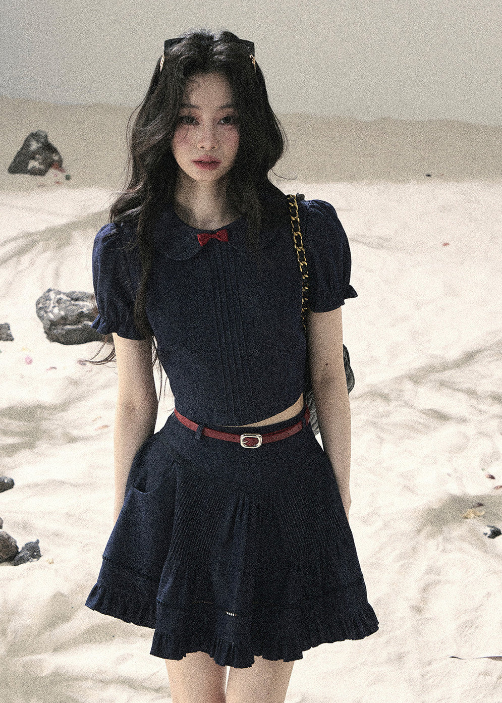 Model wearing navy two-piece summer skirt set