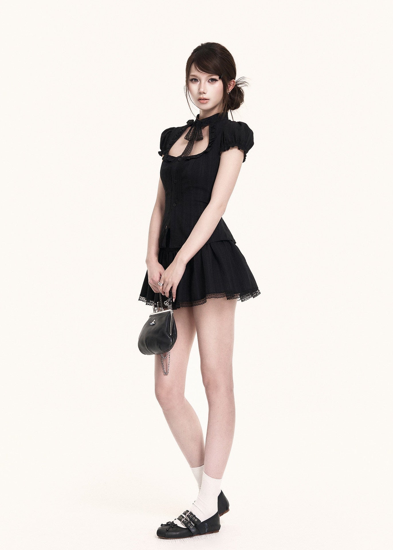 Vintage-inspired black two-piece set with a hollow neckline
