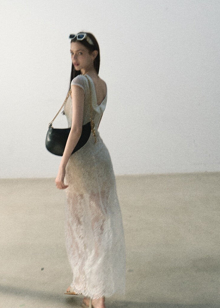 Ivory waist-defined lace dress with a semi-sheer skirt