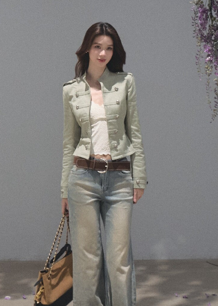 Model wearing long gradient-wash jeans with a white cropped blouse