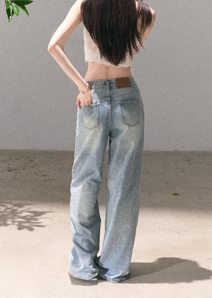 Distressed straight-leg denim pants with starry sparkle