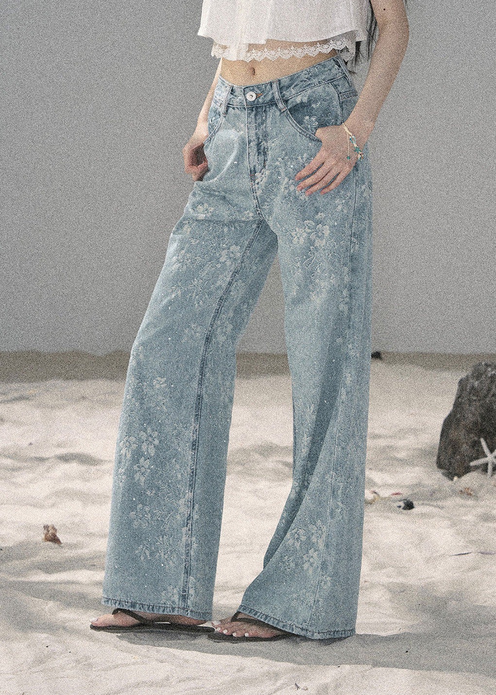 Women’s washed denim jeans with delicate flower motifs