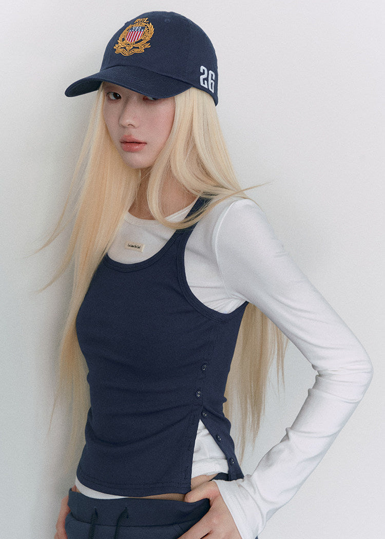 Model wearing a navy and white faux-layered top with a drawstring mini skirt