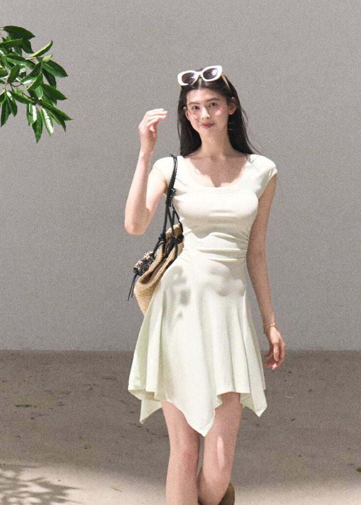 Soft green sleeveless midi dress with elegant drape