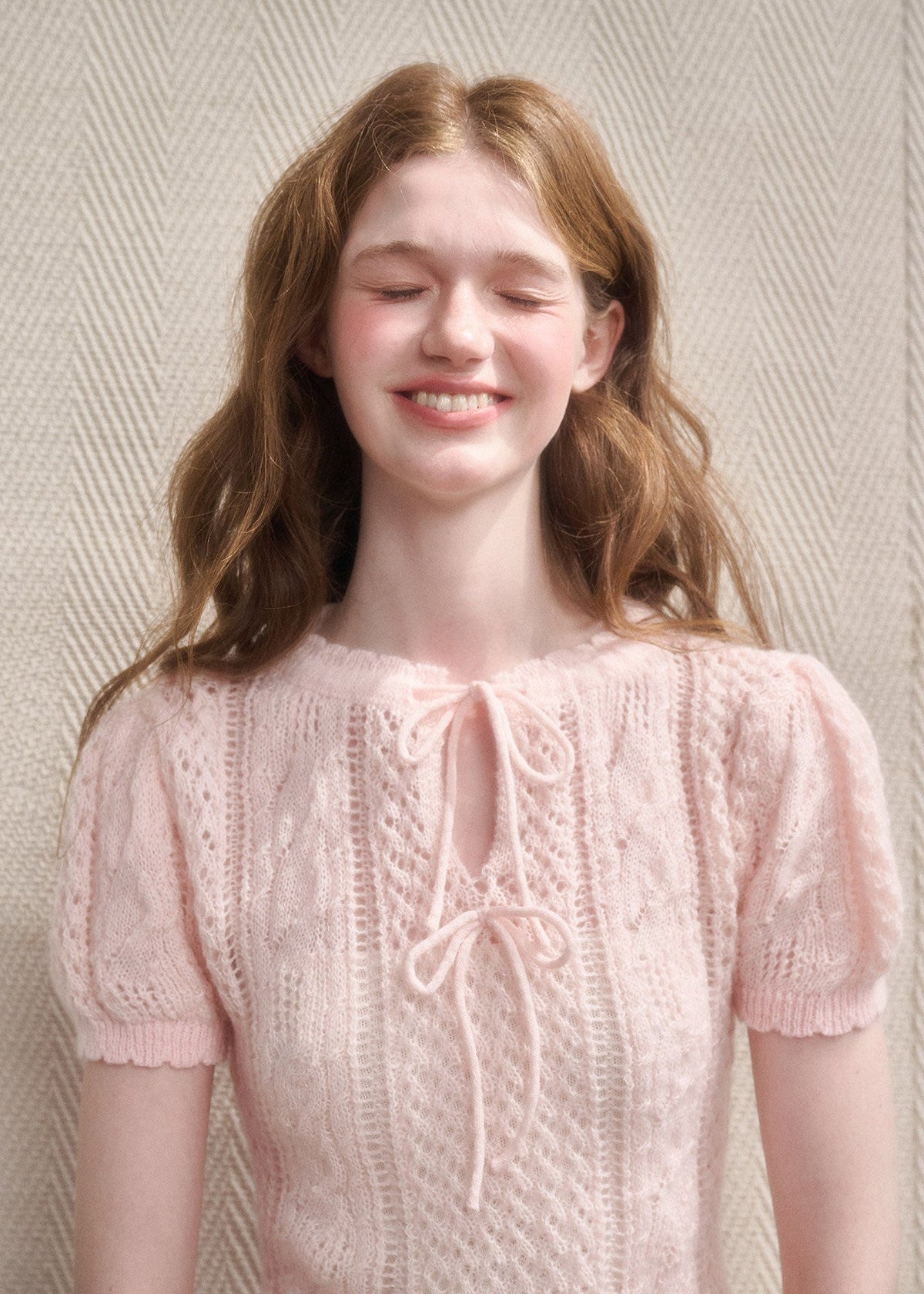 Vintage-inspired cream knit top with keyhole detail