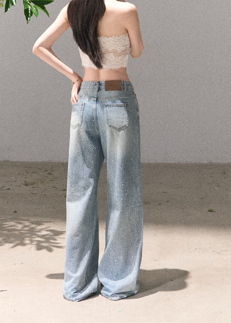 Vintage blue wide-leg jeans styled with a lace crop top