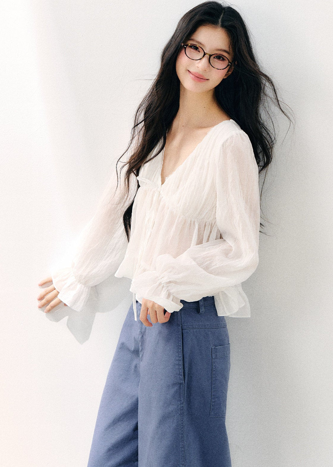 Pale yellow V-neck blouse with double-layer ruffles