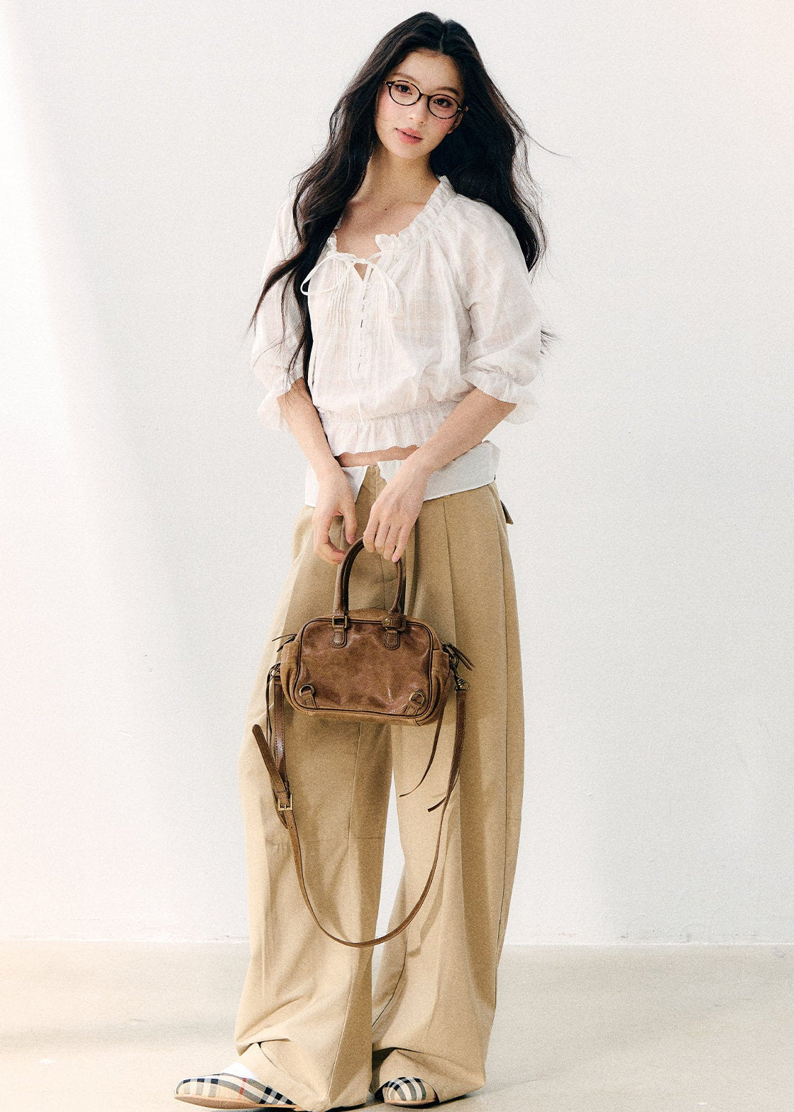 Women’s white cropped blouse with a ruffled hem