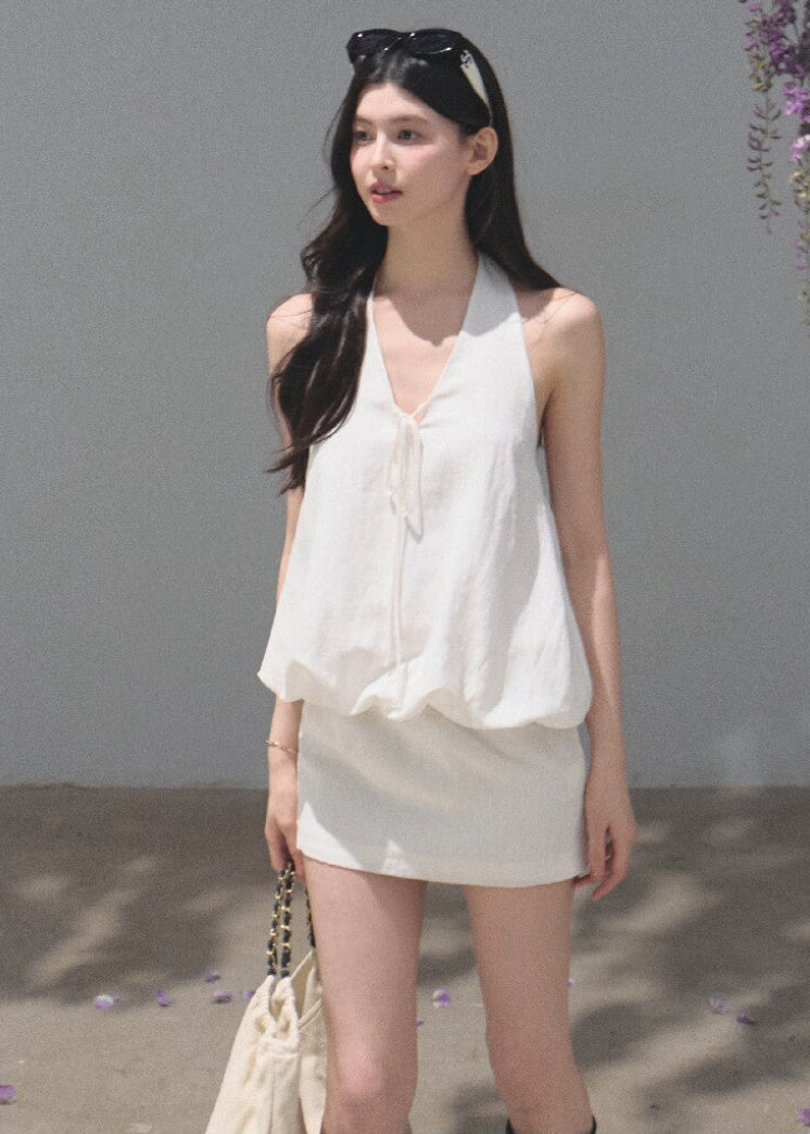 White open-back halter dress crafted from a lyocell-linen blend