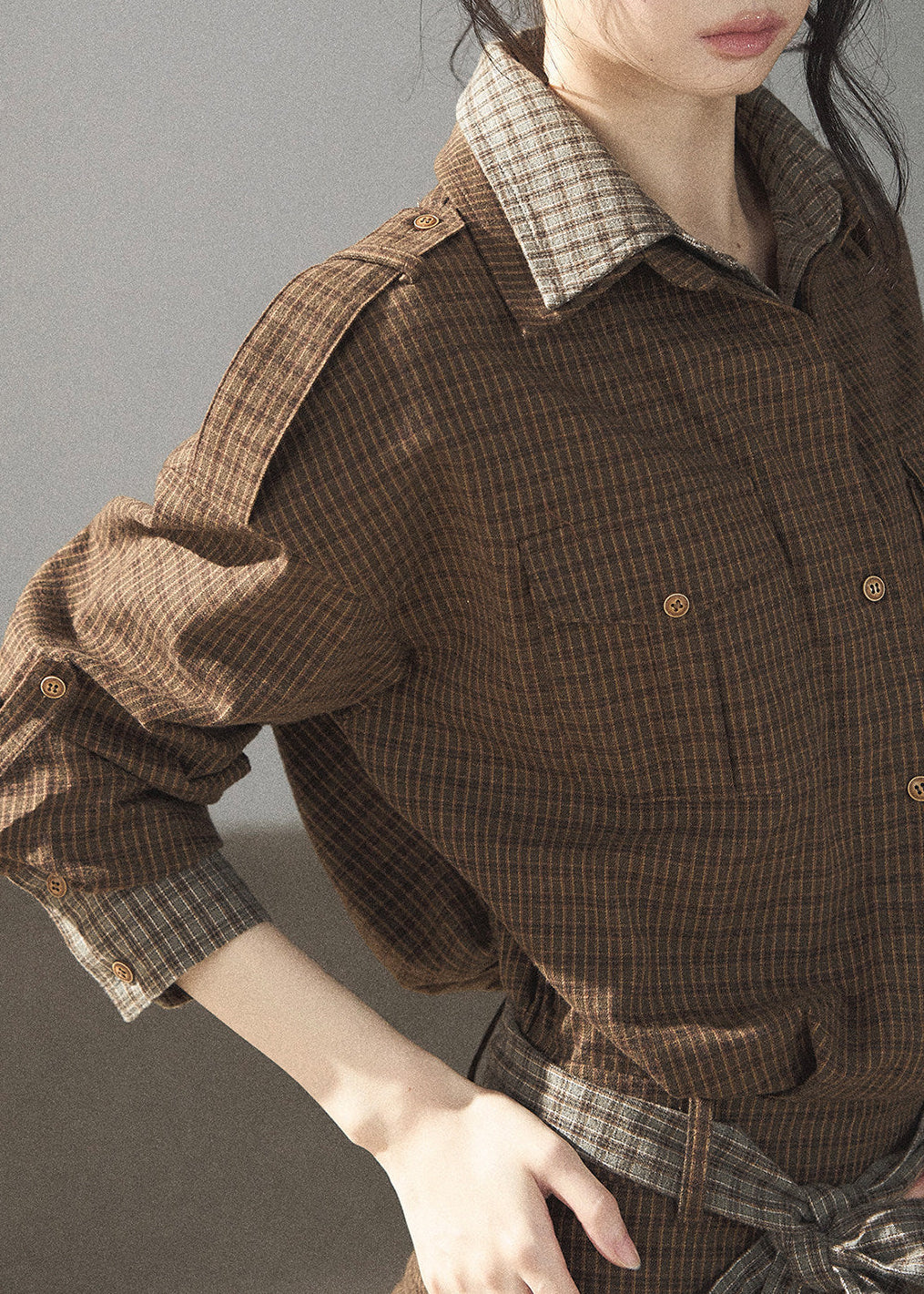 Model wearing brown plaid autumn shirt dress