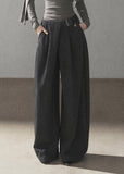 Model wearing taupe loose wide-leg pants
