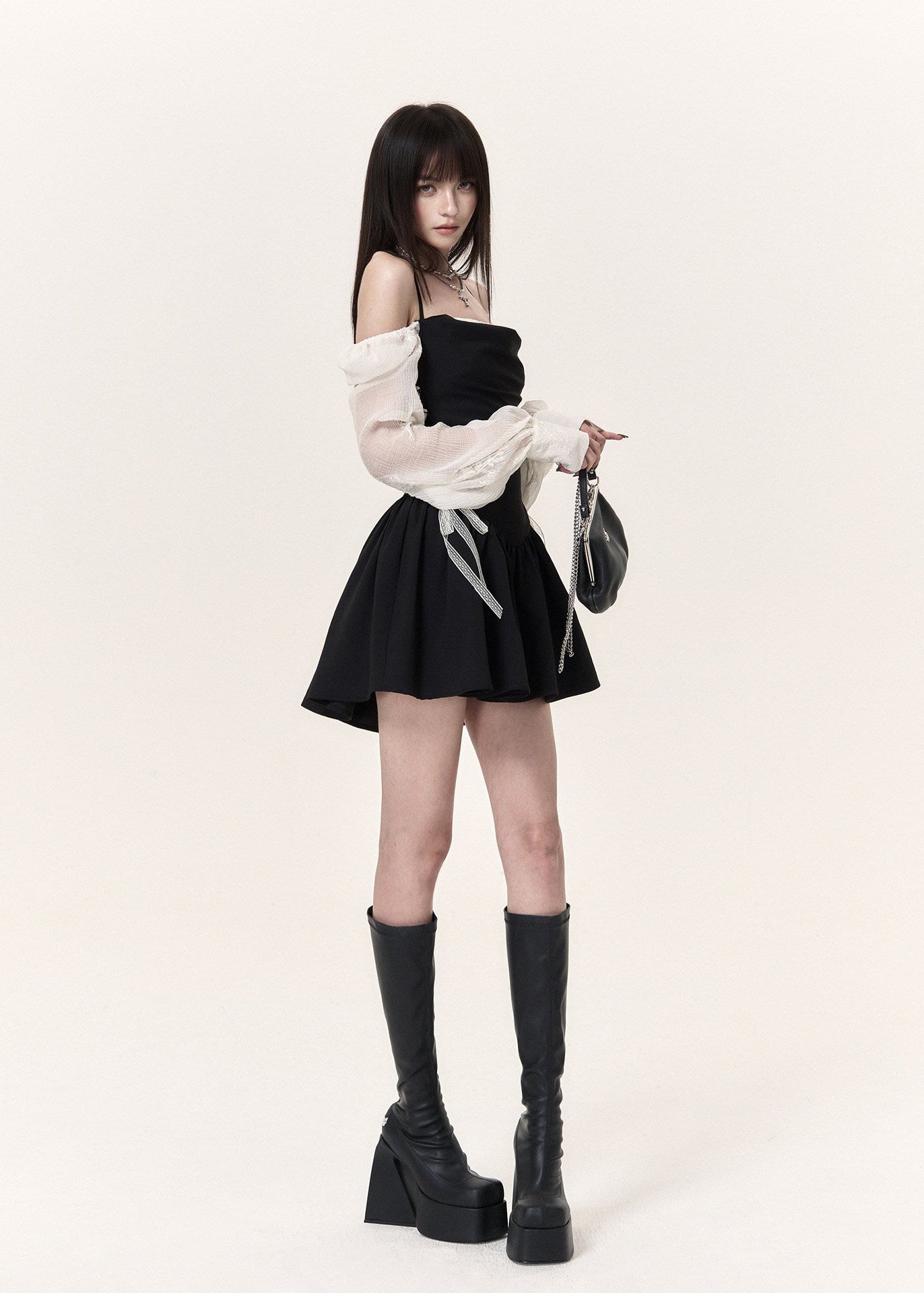 Feminine corset-style mini dress with halter straps and lace sleeves