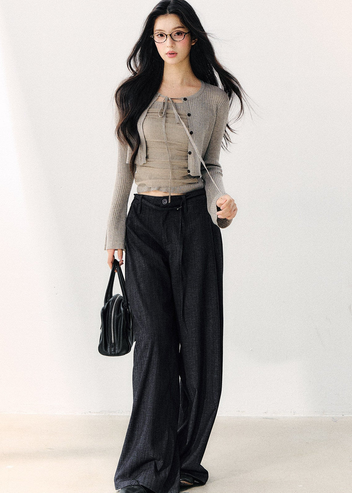 Korean-style dark pleated pants with a layered waistband
