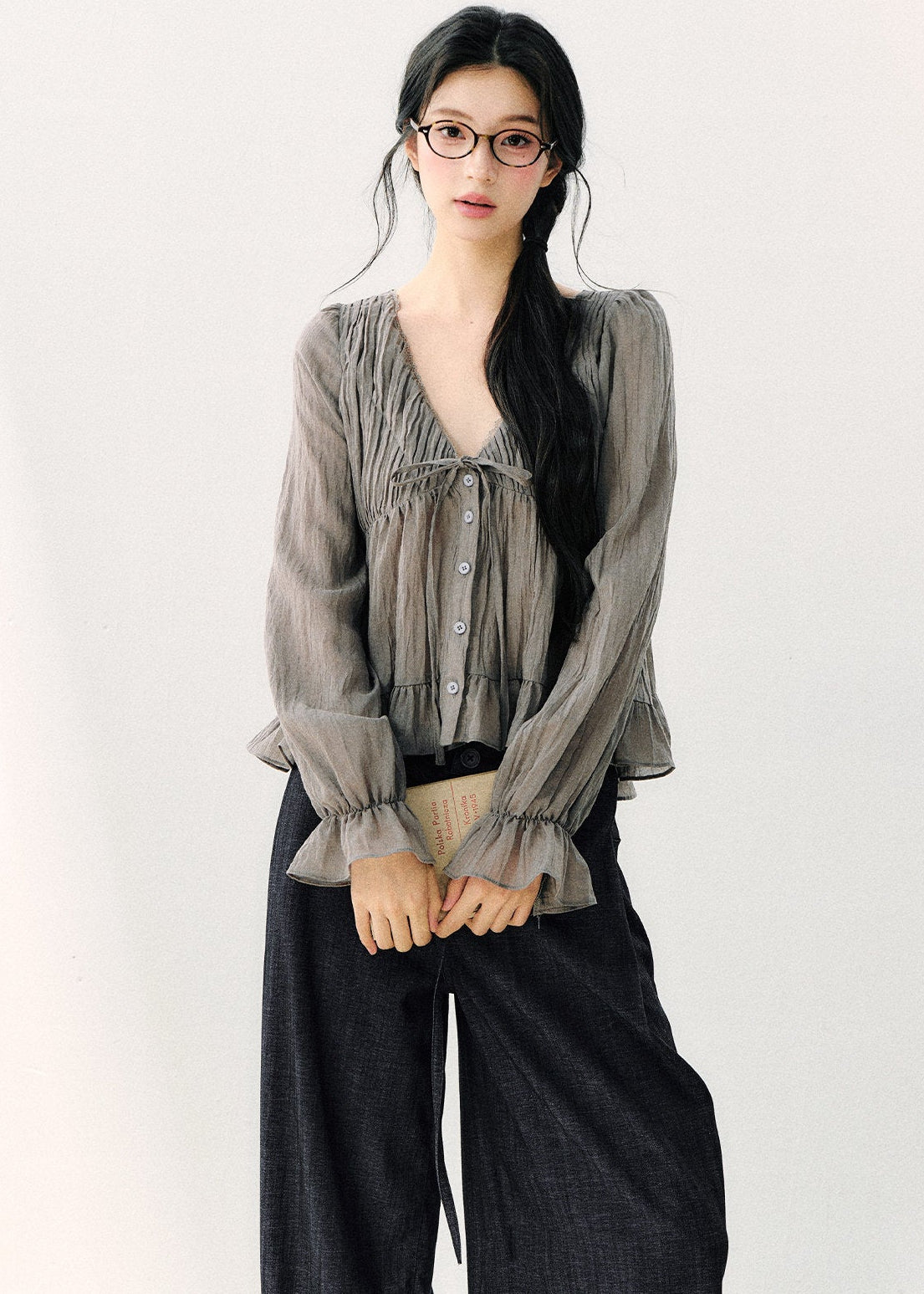 Women’s semi-sheer gray blouse with flared ruffle cuffs