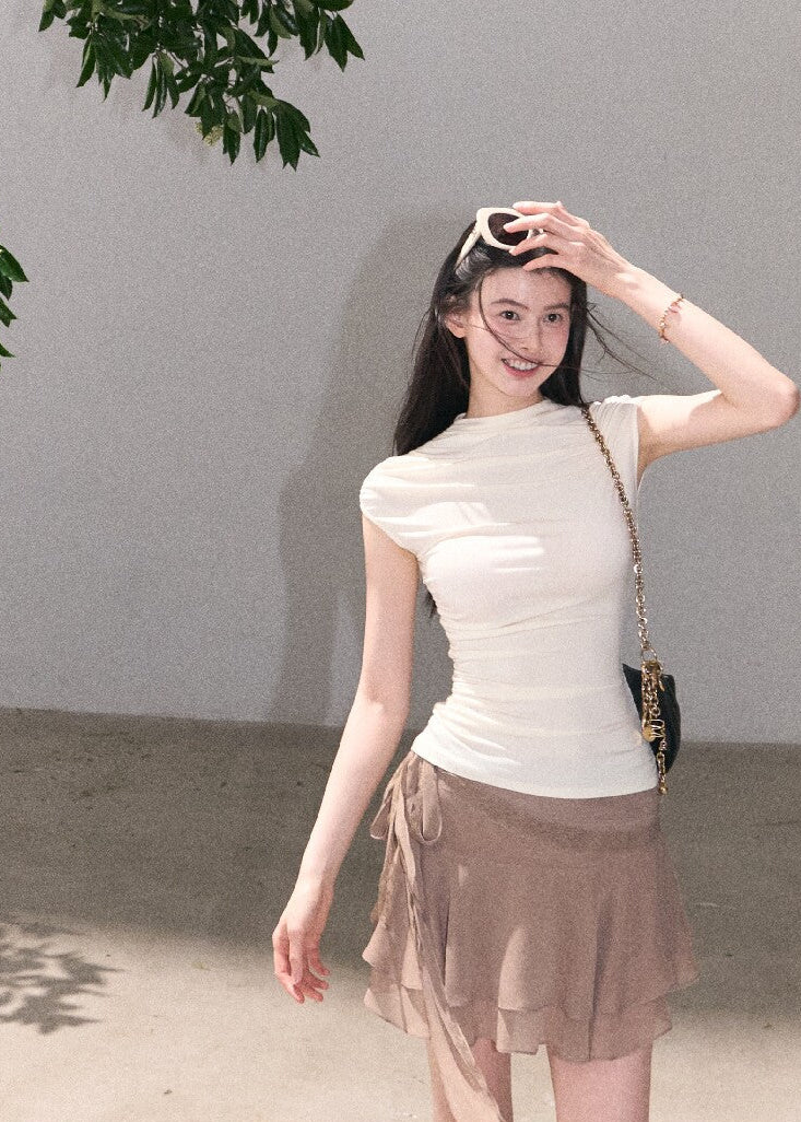 Soft draped ruffle skirt styled with boots