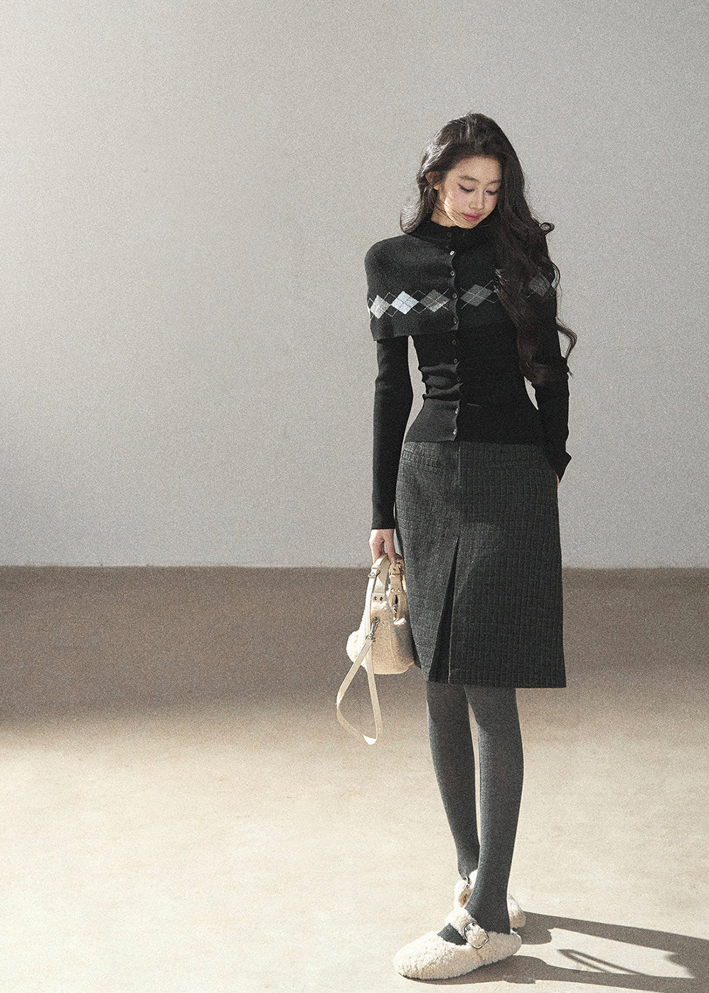 Preppy high-neck black cardigan with diamond-pattern knit overlay