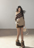 Beige Fair Isle off-shoulder cable knit sweater with multicolor jacquard pattern