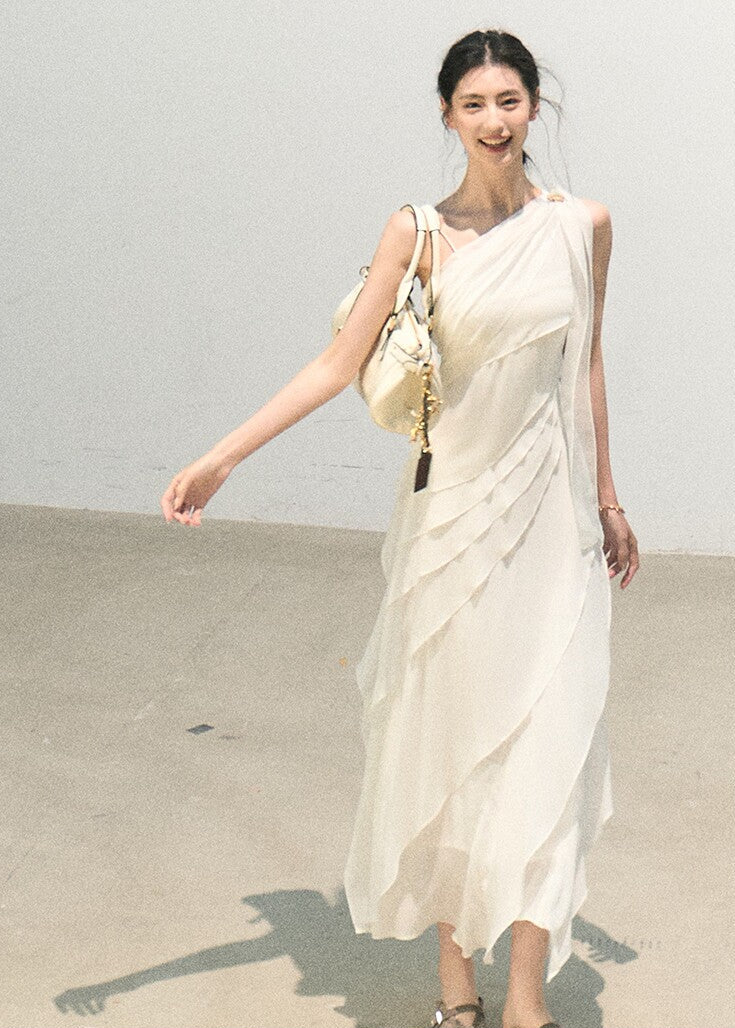 Sleeveless asymmetrical dress in soft white