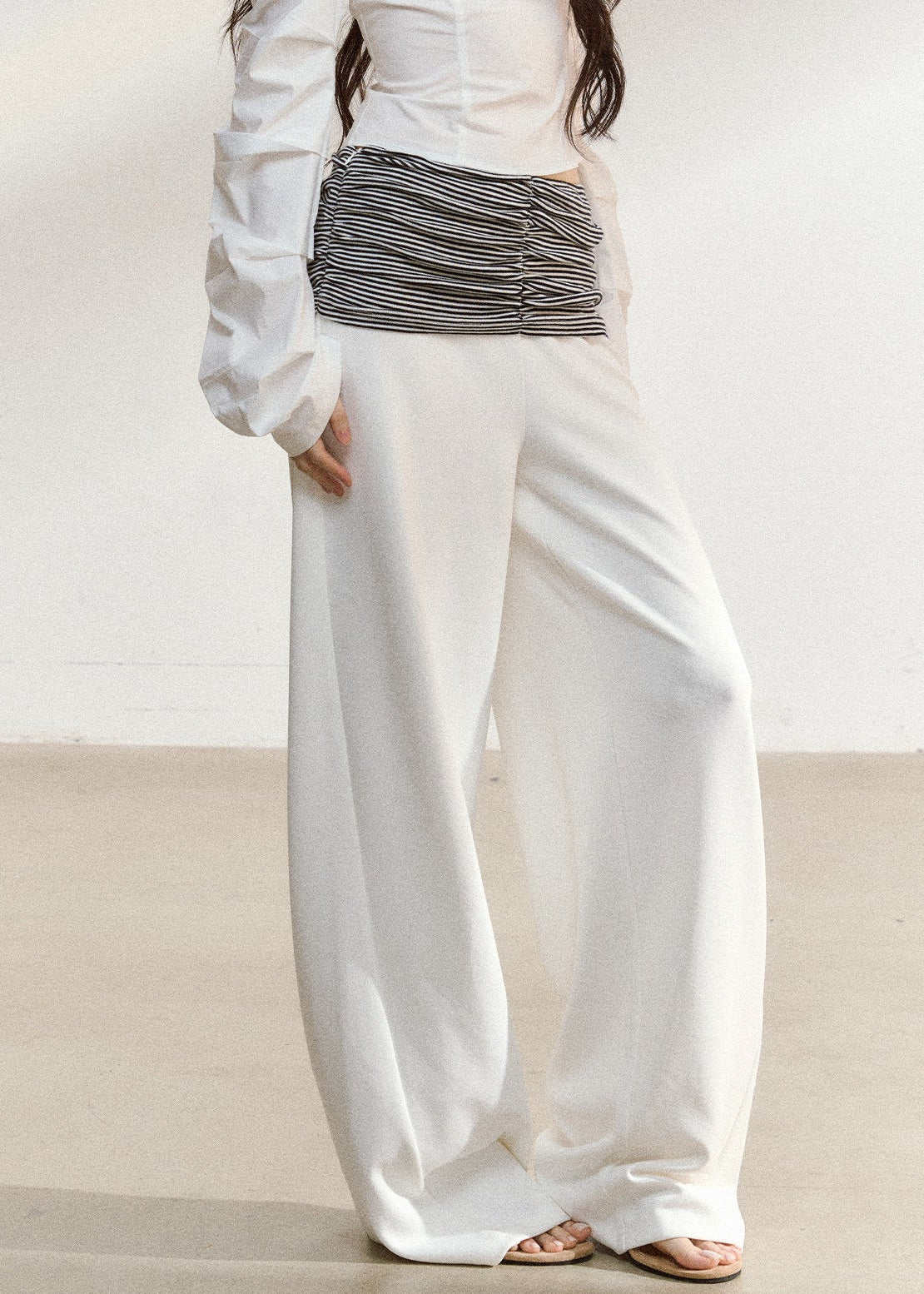 White wide-leg trousers with a ruched striped waistband