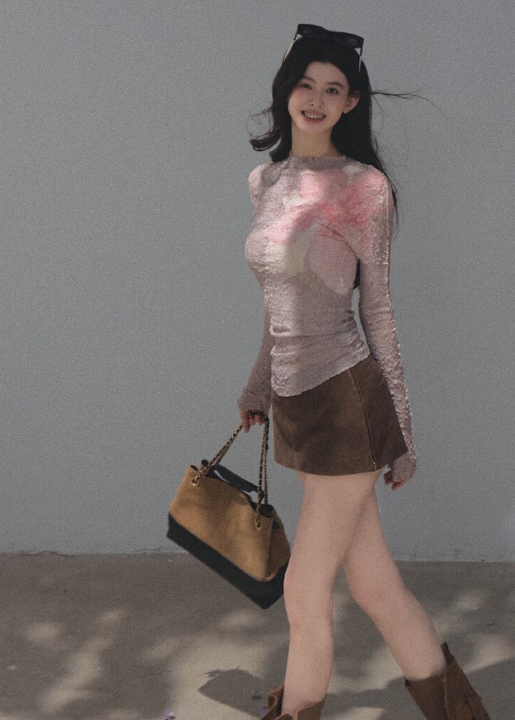 Model wearing a black botanical-print long-sleeve base layer