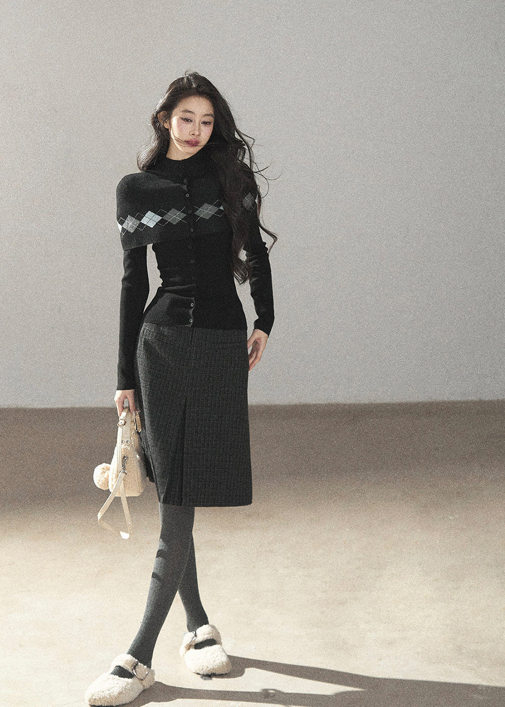 Preppy high-neck black cardigan with diamond-pattern knit overlay