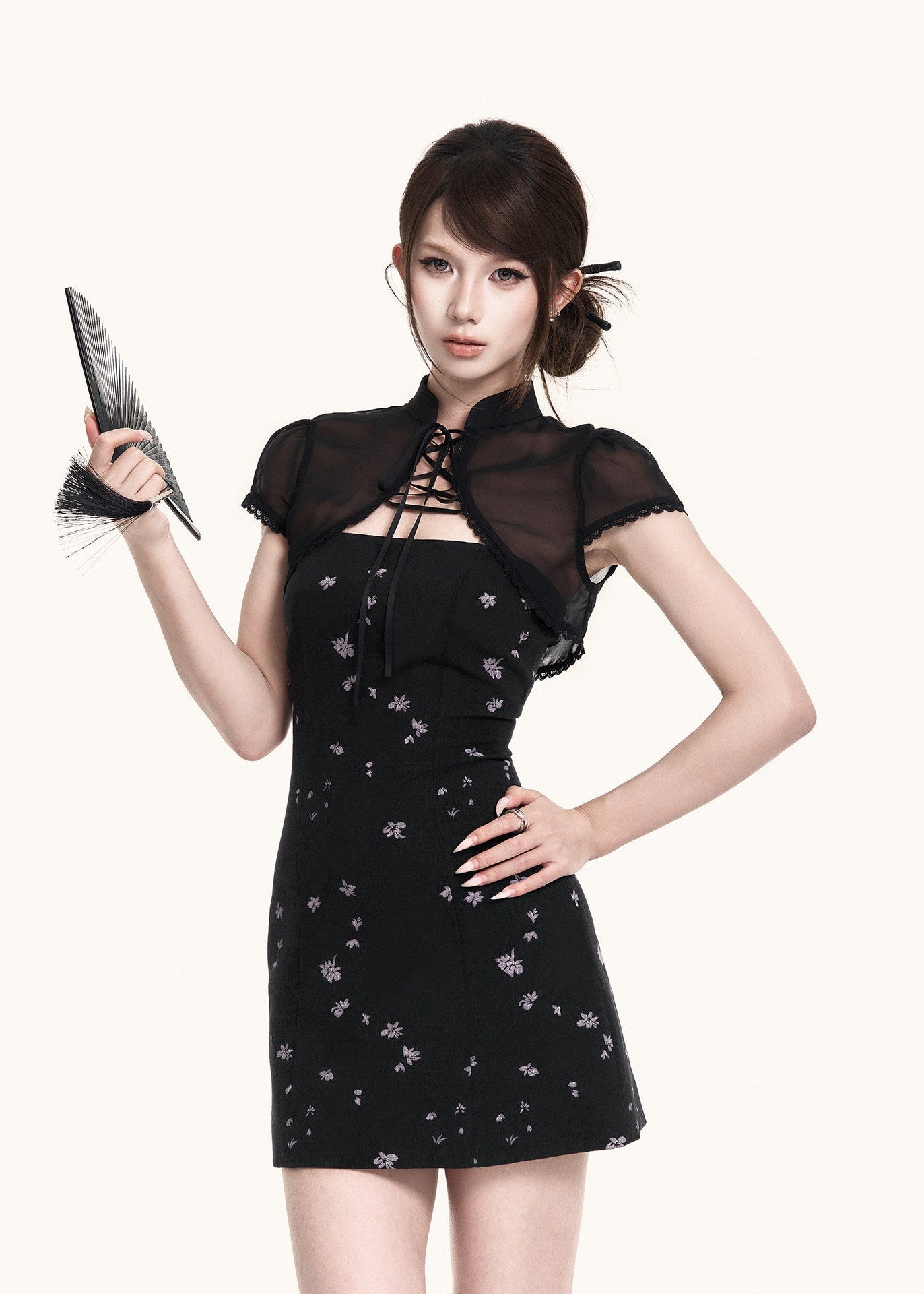 Strapless black mini dress with subtle floral print