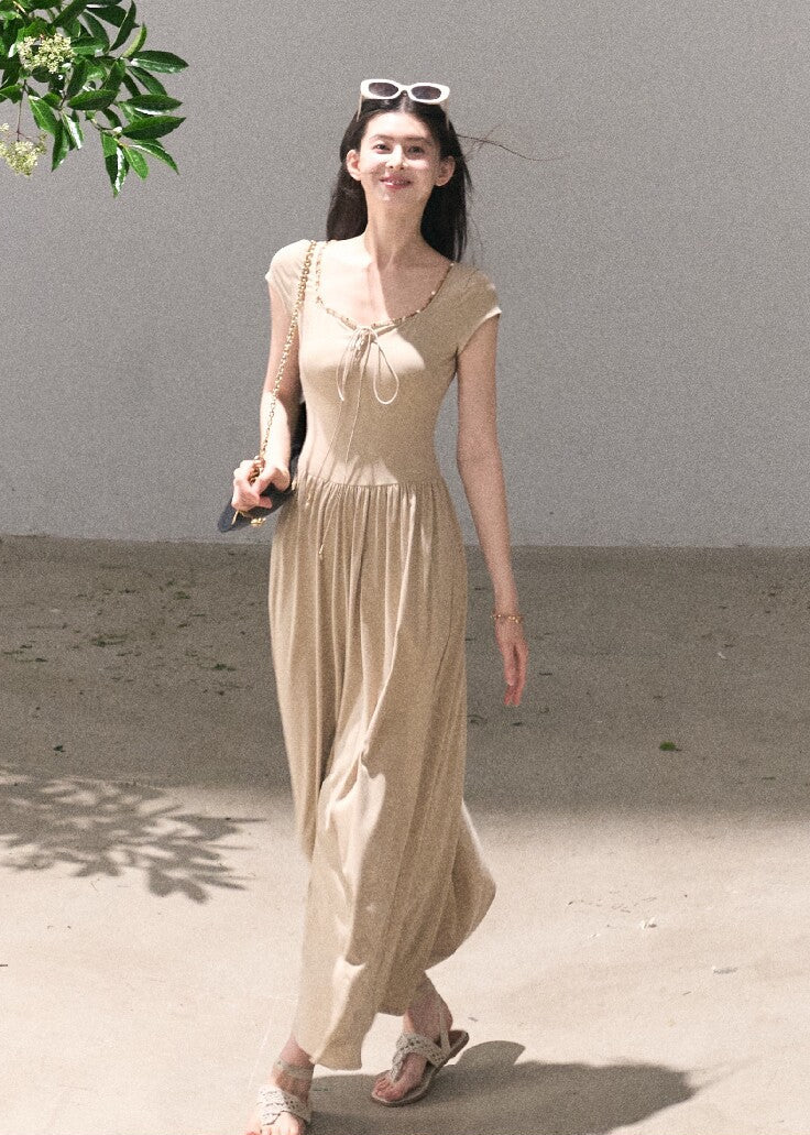 Elegant beige dress with soft waist definition
