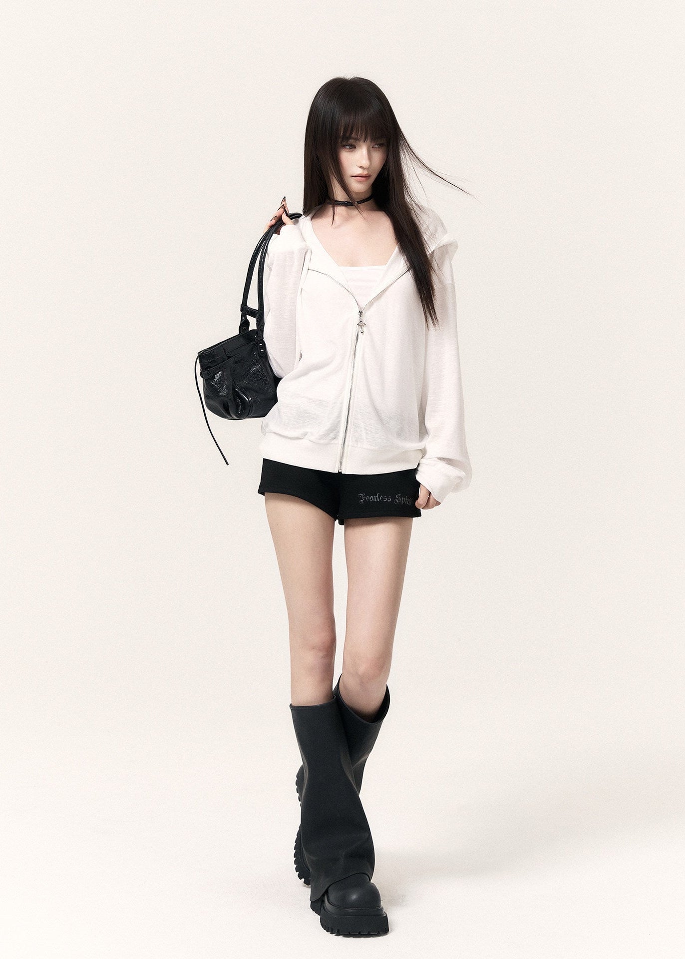Black casual shorts with a drawstring waist, cross pendants, and lettering print