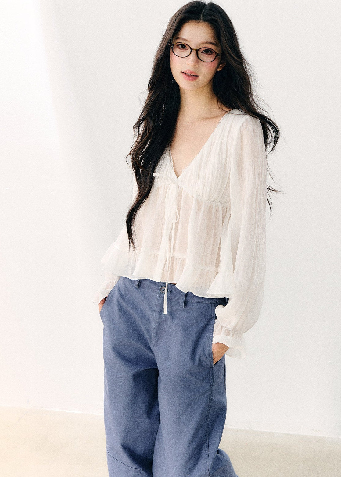 Pale yellow V-neck blouse with double-layer ruffles