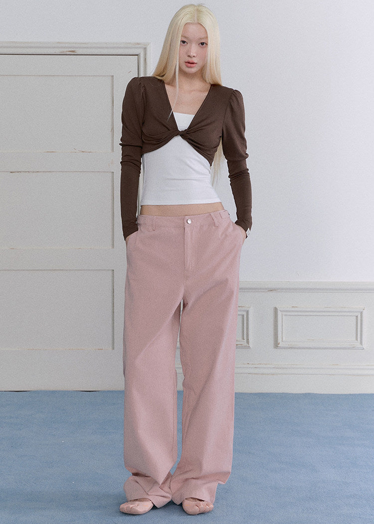 Model wearing a blue-gray ballet-inspired long-sleeve top and pants set