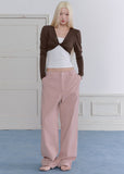 Model wearing a blue-gray ballet-inspired long-sleeve top and pants set