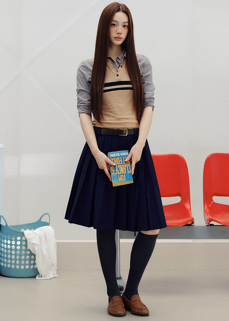 1. Sleeveless striped knit polo top styled with dark bottoms outdoors