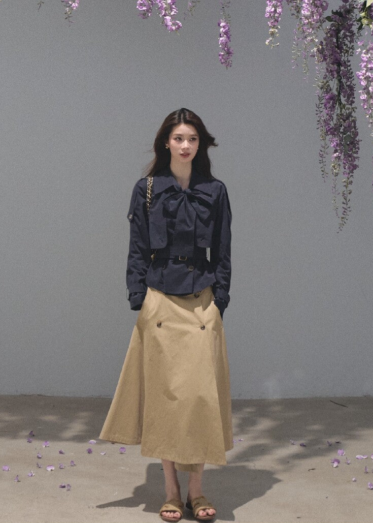 Khaki A-line midi skirt with a coordinating buckle belt