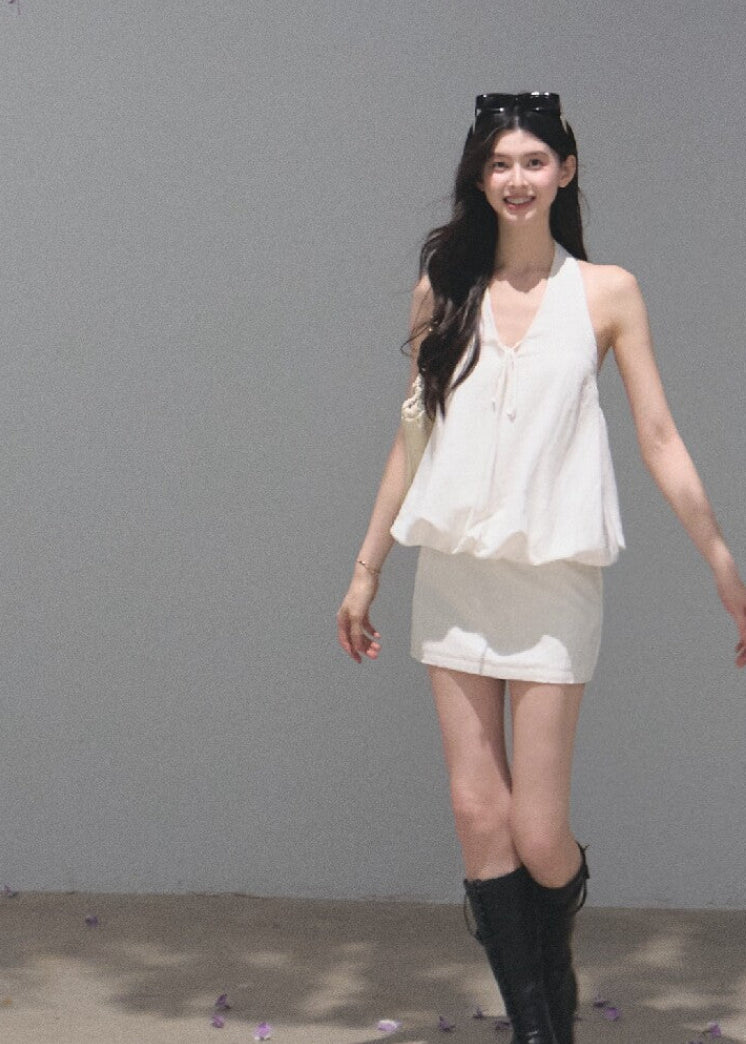 White open-back halter dress crafted from a lyocell-linen blend