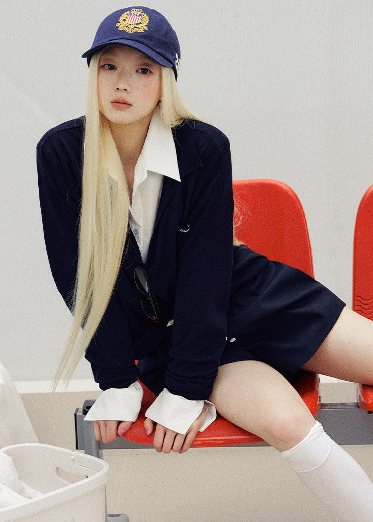 Front view of relaxed navy shorts with an elastic waist and curved hems