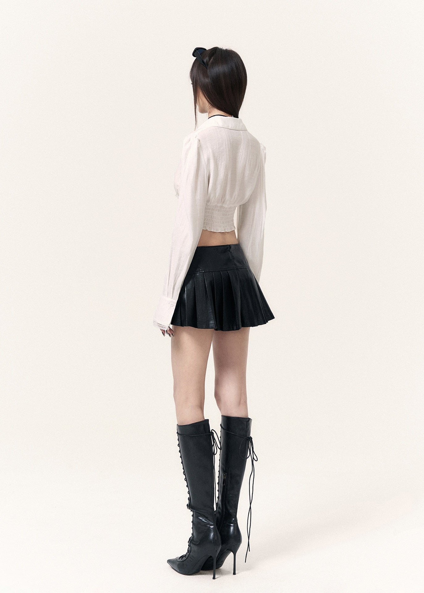 White corset-inspired shirt with long sleeves and an adjustable front tie