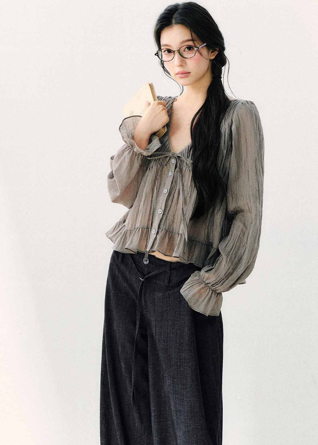 Lightweight gray long-sleeve blouse with a flowing hem