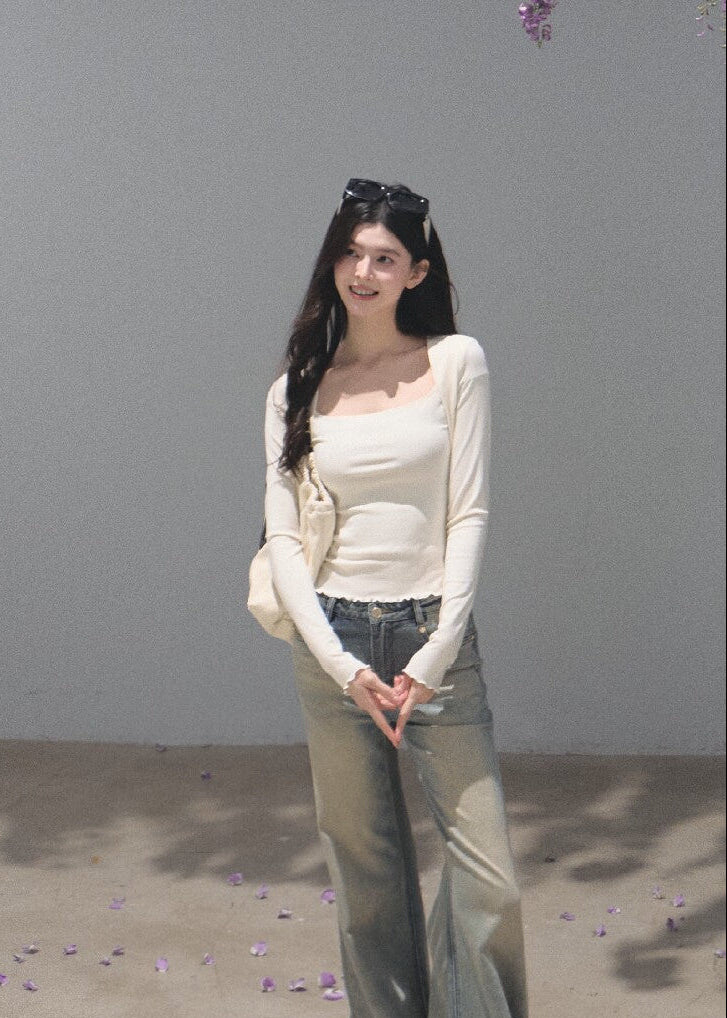 Fitted cream long-sleeve T-shirt styled with washed denim