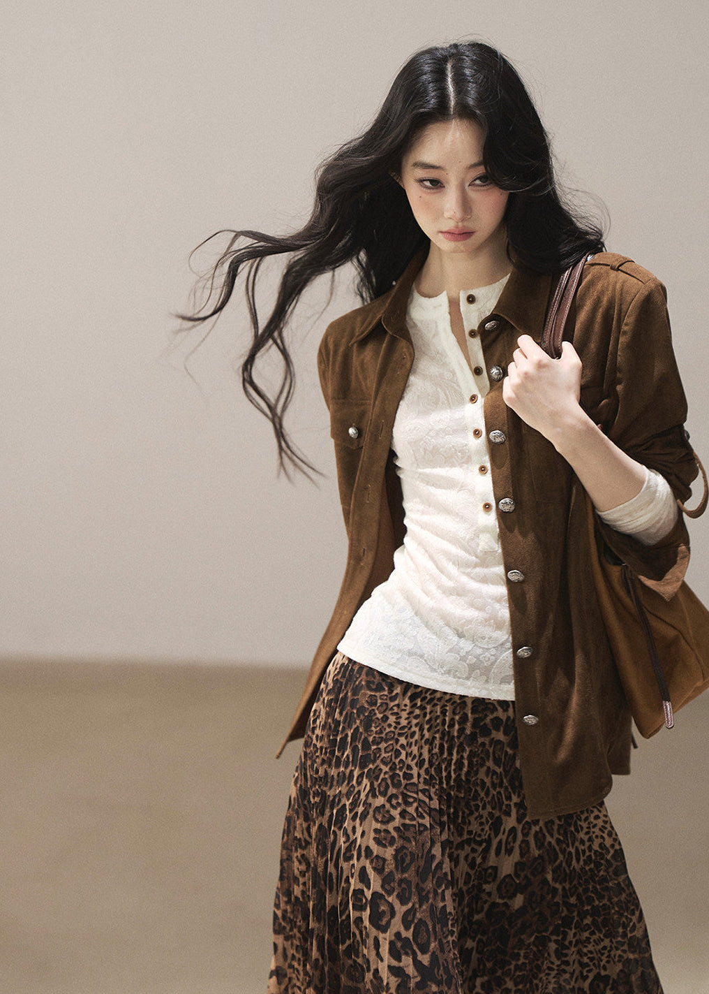 Irregular leopard midi skirt styled with boots