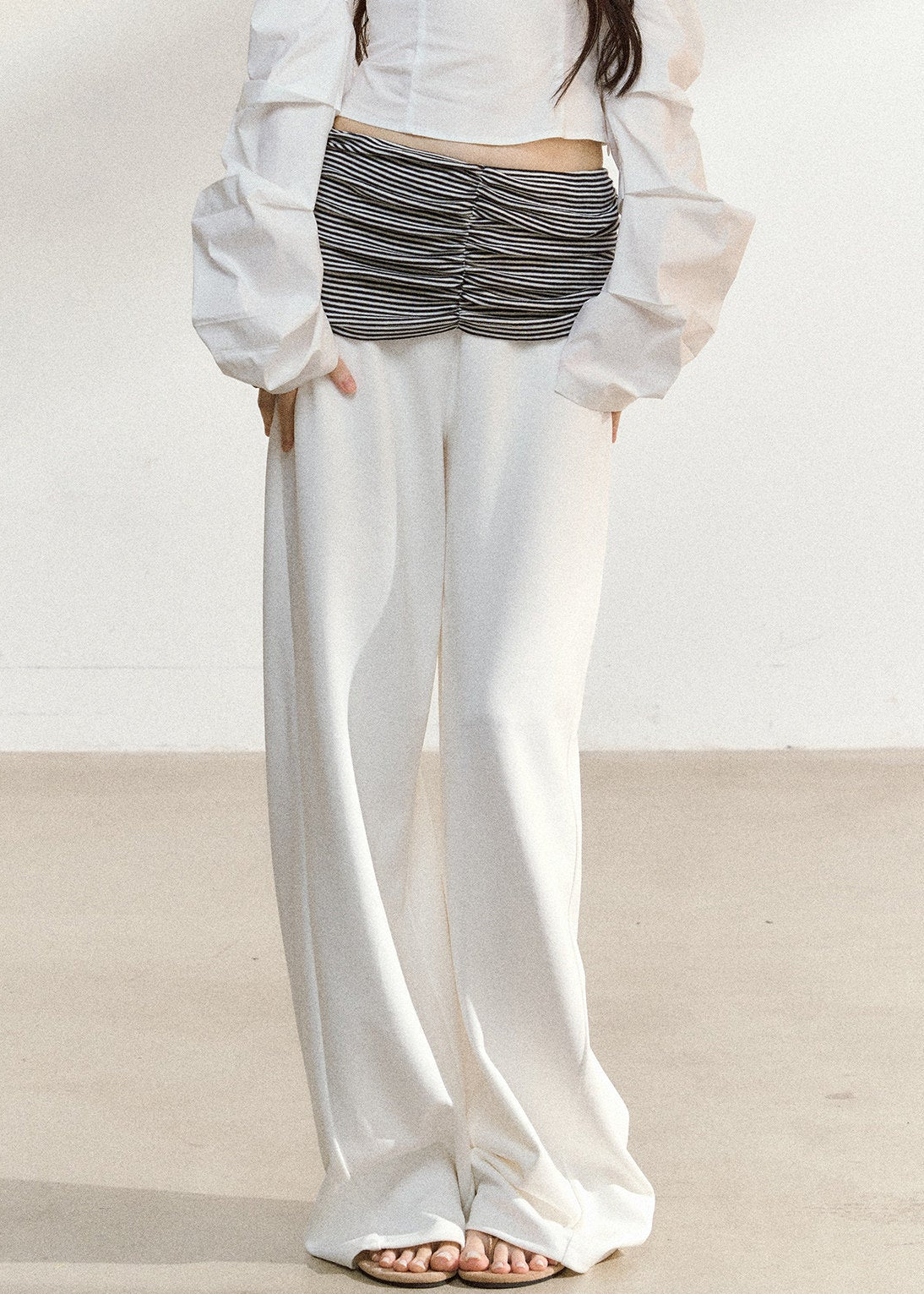 White wide-leg trousers with a ruched striped waistband
