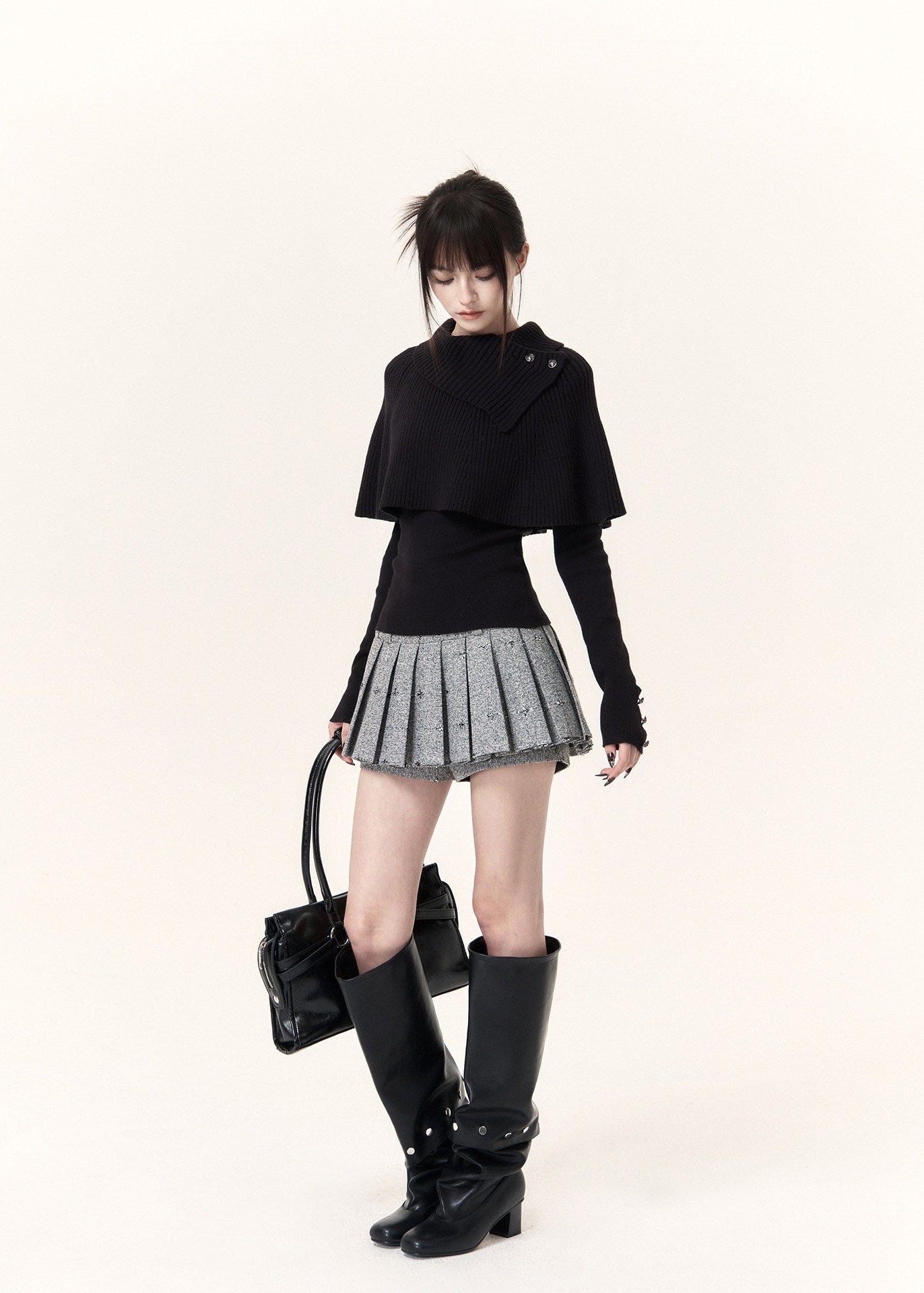 Black asymmetric cape layered knit top with button-detail neckline