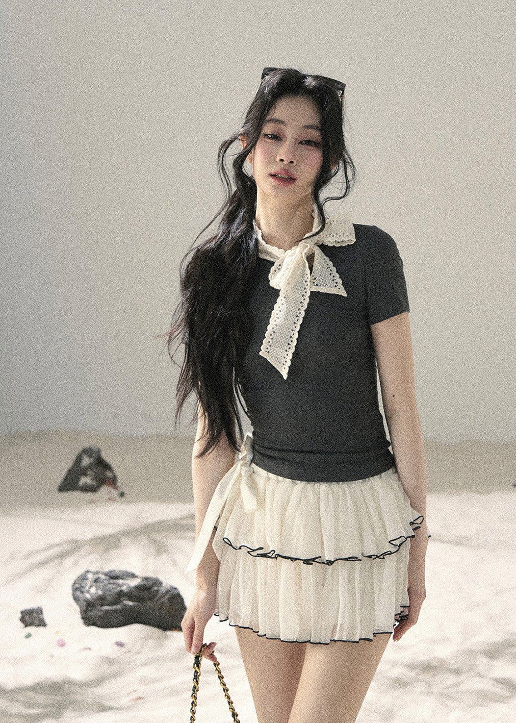 Gray fitted short-sleeve top with ivory lace bow neckline