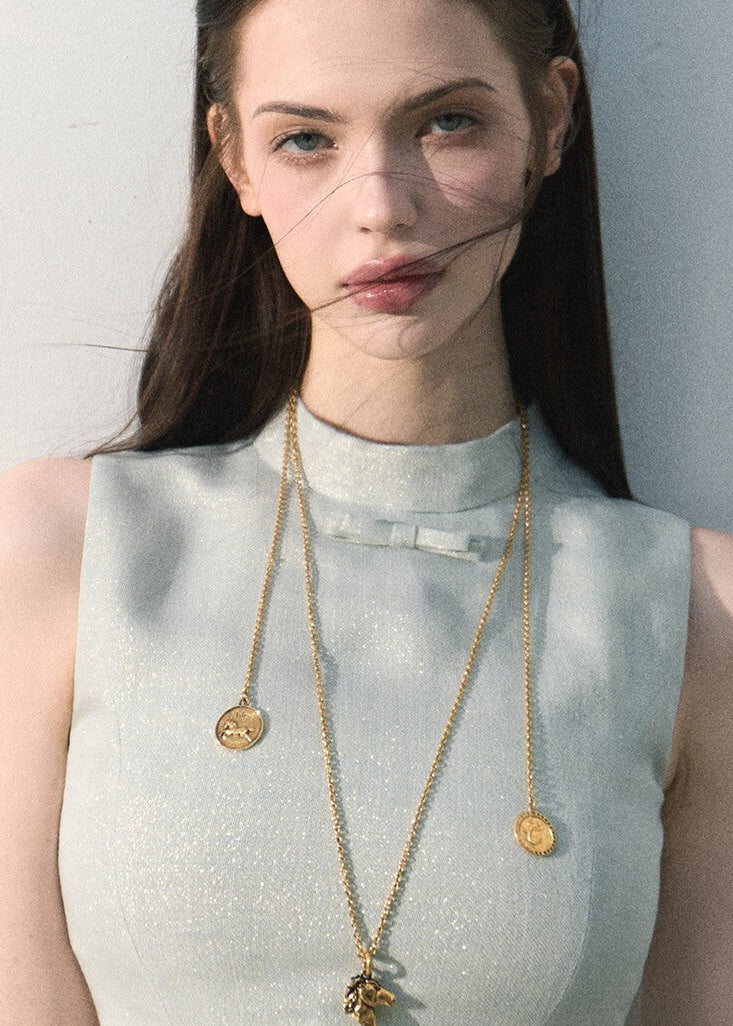 Front view of a pale blue ruffle-hem fitted top