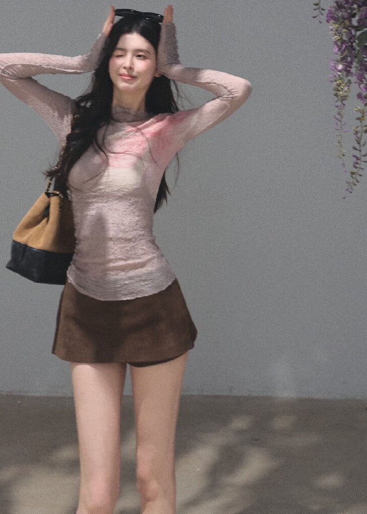 Ivory fitted top featuring a soft pink floral pattern and crinkled texture