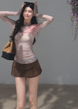 Ivory fitted top featuring a soft pink floral pattern and crinkled texture
